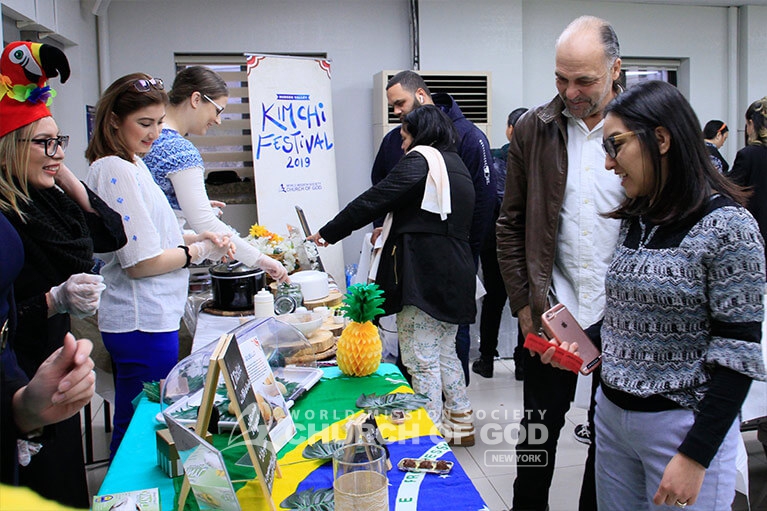 People trying Caribbean food at the Hudson Valley Kimchi Festival.