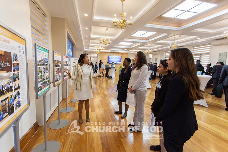 New members and guests learning about the activities and achievements of the Church of God.