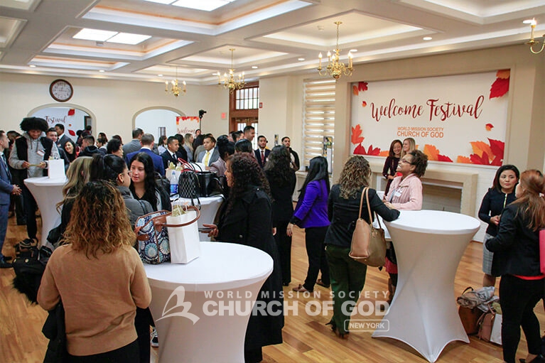 Members conversing with one another in the church dining hall.